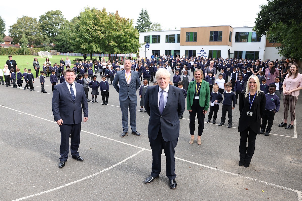 Boris Johnson, Dean Russell MP, Gillian Jackson & the staff and pupils at Beechfield in the playground