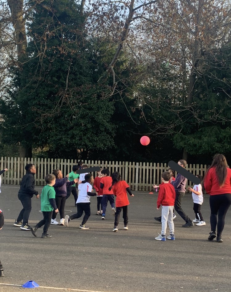 pupils play handball in the playground